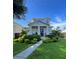 Two-story house with landscaped lawn and walkway at 2602 W Nassau St, Tampa, FL 33607