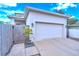White garage door and wooden fence at 2602 W Nassau St, Tampa, FL 33607