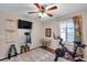 Home gym with stationary bike, weights and mirror at 2602 W Nassau St, Tampa, FL 33607