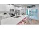 Modern kitchen with white cabinets, stainless steel appliances, and large island at 2602 W Nassau St, Tampa, FL 33607