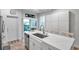 Modern kitchen with island, stainless steel appliances, and backyard access at 2602 W Nassau St, Tampa, FL 33607