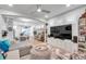 Open living space with sectional sofa, TV, and kitchen view at 2602 W Nassau St, Tampa, FL 33607