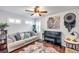 Bright living room featuring comfortable seating and large artwork at 2602 W Nassau St, Tampa, FL 33607