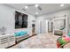 Main bedroom with large TV, sitting area and mirrored closet doors at 2602 W Nassau St, Tampa, FL 33607