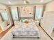 Spacious main bedroom with king-size bed and mirrored closet doors at 2602 W Nassau St, Tampa, FL 33607