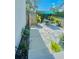 Concrete pathway and patio with lush landscaping at 2602 W Nassau St, Tampa, FL 33607
