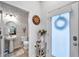 Small half bathroom with pedestal sink and white brick feature wall at 2602 W Nassau St, Tampa, FL 33607