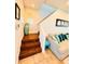 Wooden staircase and sitting area with sectional sofa at 2602 W Nassau St, Tampa, FL 33607