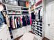 Large walk-in closet with ample shelving and hanging space at 2602 W Nassau St, Tampa, FL 33607