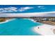 Aerial view of expansive lagoon pool and community features at 31428 Briars Ml, San Antonio, FL 33576