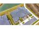 Aerial view of home near lake with gray tile roof at 31428 Briars Ml, San Antonio, FL 33576