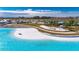 Aerial view of crystal-clear lagoon pool and surrounding landscape at 31428 Briars Ml, San Antonio, FL 33576