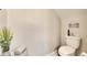 Small bathroom with toilet and decorative wall art at 31428 Briars Ml, San Antonio, FL 33576