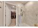Bathroom with shower and access to a walk-in closet at 31428 Briars Ml, San Antonio, FL 33576