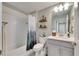 Bathroom with tub, shower, and wood shelves at 31428 Briars Ml, San Antonio, FL 33576