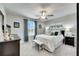 Bright bedroom with a king-size bed and large window at 31428 Briars Ml, San Antonio, FL 33576