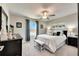 Spacious bedroom featuring a king bed and natural light at 31428 Briars Ml, San Antonio, FL 33576
