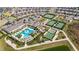 Aerial view of community with pool, tennis courts, and other amenities at 31428 Briars Ml, San Antonio, FL 33576