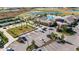 Aerial view of community clubhouse with pool, parking and tennis courts at 31428 Briars Ml, San Antonio, FL 33576