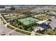 Aerial view of community amenities including tennis courts and a clubhouse at 31428 Briars Ml, San Antonio, FL 33576