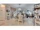 Bright dining area with round table and modern chandelier at 31428 Briars Ml, San Antonio, FL 33576