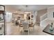 Modern dining area with kitchen view and pendant lighting at 31428 Briars Ml, San Antonio, FL 33576