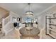 Open concept dining room with kitchen access and modern lighting at 31428 Briars Ml, San Antonio, FL 33576