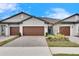 Three-car garage and attractive landscaping at 31428 Briars Ml, San Antonio, FL 33576