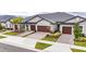 Three-unit building with attached garages and landscaping at 31428 Briars Ml, San Antonio, FL 33576