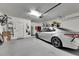 Garage with car, ample storage and overhead door at 31428 Briars Ml, San Antonio, FL 33576