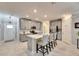 Open concept kitchen with island and stainless steel appliances at 31428 Briars Ml, San Antonio, FL 33576