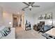 Bright office with large windows, desk, and couch at 31428 Briars Ml, San Antonio, FL 33576