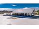 Poolside bar with outdoor seating and a metal roof at 31428 Briars Ml, San Antonio, FL 33576