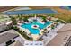 Aerial view of resort-style pool with expansive deck and landscaping at 31428 Briars Ml, San Antonio, FL 33576