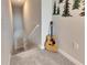 Upstairs landing with guitar and wall decor at 31428 Briars Ml, San Antonio, FL 33576