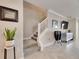Staircase with white railing and grey carpeting at 31428 Briars Ml, San Antonio, FL 33576
