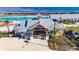 Community welcome center with a metal roof and signage at 31428 Briars Ml, San Antonio, FL 33576