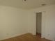 Empty bedroom with closet and wood floors at 3201 Delaware W Ave, Plant City, FL 33563
