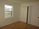 Bright bedroom with wood floors and double door closet at 3201 Delaware W Ave, Plant City, FL 33563