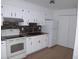 Bright kitchen, white cabinets, stone backsplash at 3201 Delaware W Ave, Plant City, FL 33563