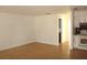 Spacious living area with hardwood floors and access to kitchen at 3201 Delaware W Ave, Plant City, FL 33563