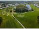 Golf course with golfers and surrounding area at 3521 Teeside Dr # 3521, New Port Richey, FL 34655