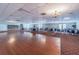 Large banquet hall with hardwood dance floor and tables at 3521 Teeside Dr # 3521, New Port Richey, FL 34655