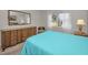 Bedroom with a dresser and view of the backyard at 3521 Teeside Dr # 3521, New Port Richey, FL 34655