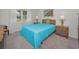 Cozy bedroom with a queen-size bed and wood furniture at 3521 Teeside Dr # 3521, New Port Richey, FL 34655