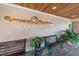 Seven Springs Golf & Country Club entrance with benches and landscaping at 3521 Teeside Dr # 3521, New Port Richey, FL 34655