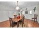 Simple dining area with wooden table and chairs at 3521 Teeside Dr # 3521, New Port Richey, FL 34655