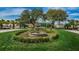 Landscaped courtyard with a tiered fountain at 3521 Teeside Dr # 3521, New Port Richey, FL 34655