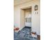 Condo entrance with tiled flooring and potted plants at 3521 Teeside Dr # 3521, New Port Richey, FL 34655