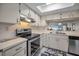 Bright kitchen features stainless steel appliances and ample cabinet space at 3521 Teeside Dr # 3521, New Port Richey, FL 34655